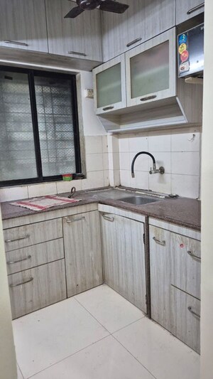 Kitchen in 2 BHK Apartment at Royal Palms, Goregaon East – for Rent