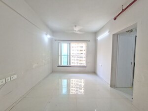 Living Room in 2 BHK Apartment at Rustomjee Azziano Wing K, Thane West – for Sale