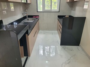 Kitchen in 2.5 BHK Apartment at Model Colony – for Rent