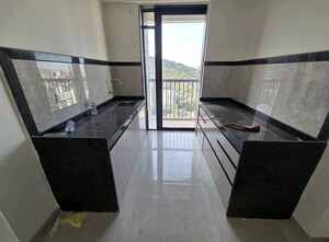 Kitchen in 2 BHK Apartment at Dhamji Shamji Mahavir Spring Tulip Phase 1, Pokhran Road No Two – for Rent