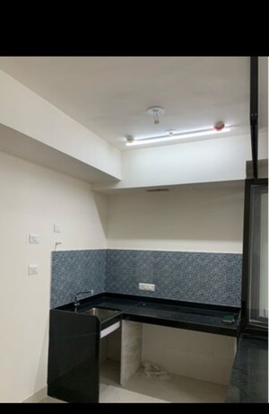 Kitchen in 1 BHK Apartment at Lodha Quality Home Tower 2, Majiwada – for Rent