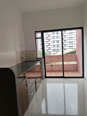 Kitchen in 2 BHK Apartment at Kumar Pebble Park, Hadapsar – for Rent