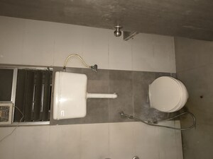 Bathroom in 2 BHK Apartment at Unique Poonam Estate Cluster 2, Mira Road – for Rent