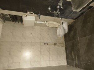 Bathroom in 2 BHK Apartment at Unique Poonam Estate Cluster 2, Mira Road – for Rent
