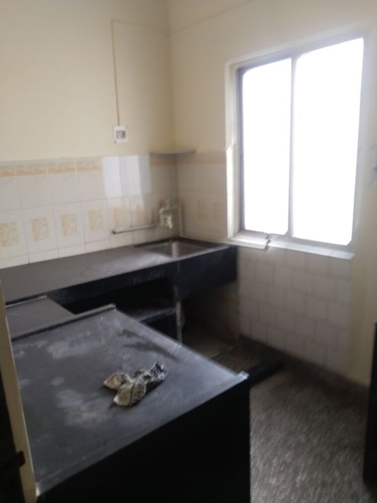 Kitchen, nina-apartments 2 Bedroom 900 Sq.Ft. Apartment In Modi Colony Pune 10650406