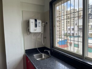 Kitchen in 3 BHK Apartment at Raichandani Megha Terrace CHS, Aundh – for Rent