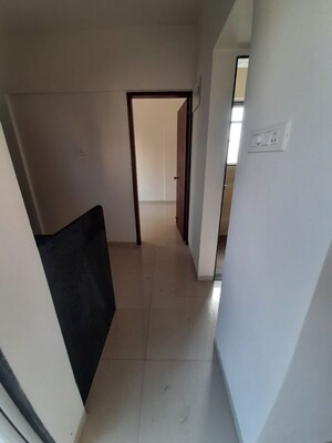 Building Lobby in 1 BHK Apartment at Ajmera Exotica, Wagholi – for Rent