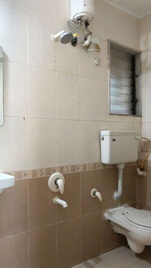 Bathroom in 1 BHK Apartment at Dheeraj Solitaire, Malad West – for Rent