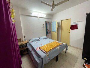 Bedroom in 2 BHK Apartment at Satyam Aracade, Wadgaon Sheri – for Rent