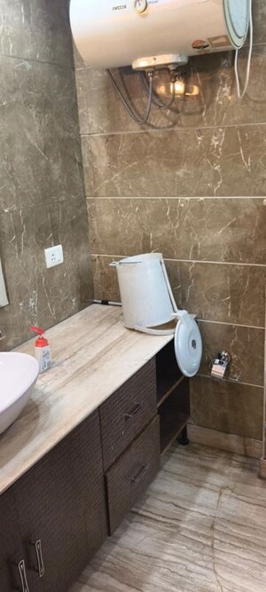 Bathroom in 4 BHK Builder Floor at Green Park Extension – for Rent