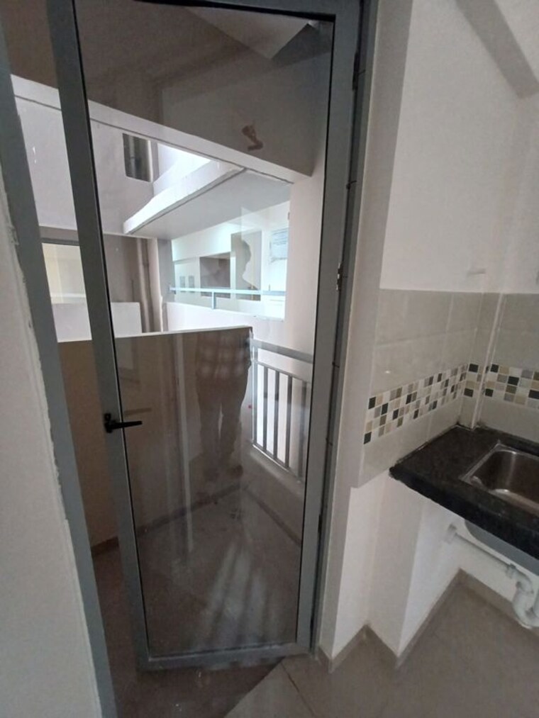 Kitchen, mahindra-happinest-tathawade-phase-1 1 Bedroom 474 Sq.Ft. Apartment In Tathawade Pune 10651393