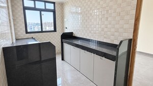 Kitchen in 2 BHK Apartment at Dhanlaxmi Dhananjay Hill View, Nalasopara West – for Sale