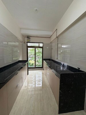 Kitchen in 3 BHK Apartment at Je And Vee Om Trimurti, Malad East – for Sale