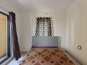Bedroom in 1 BHK Apartment at Unnati Woods CHS, Kasarvadavali – for Rent