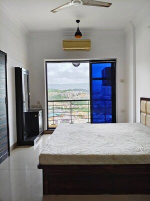 Bedroom in 2 BHK Apartment at K Raheja Heights, Malad East – for Rent