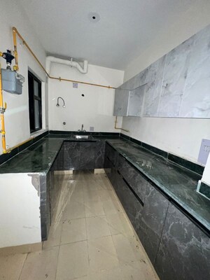 Kitchen in 2 BHK Apartment at Ansal Crown Heights, Sector 80 – for Rent