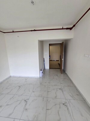 Building Lobby in 2 BHK Apartment at MICL Aaradhya Parkwood, Mira Road – for Rent