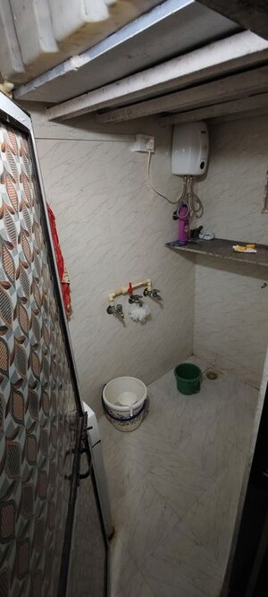 Bathroom in 1 BHK Apartment at Kapasi Niwas CHS, Malad West – for Rent
