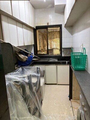 Kitchen in 2 BHK Apartment at Dheeraj Apartments, Peddar Road – for Rent