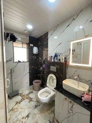 Bathroom in 2 BHK Apartment at Jasmine Tower, Vasant Vihar – for Rent