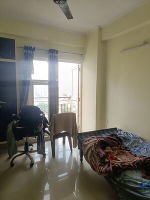Living Room in 2 BHK Apartment at Aims Golf City, Sector 75 – for Rent