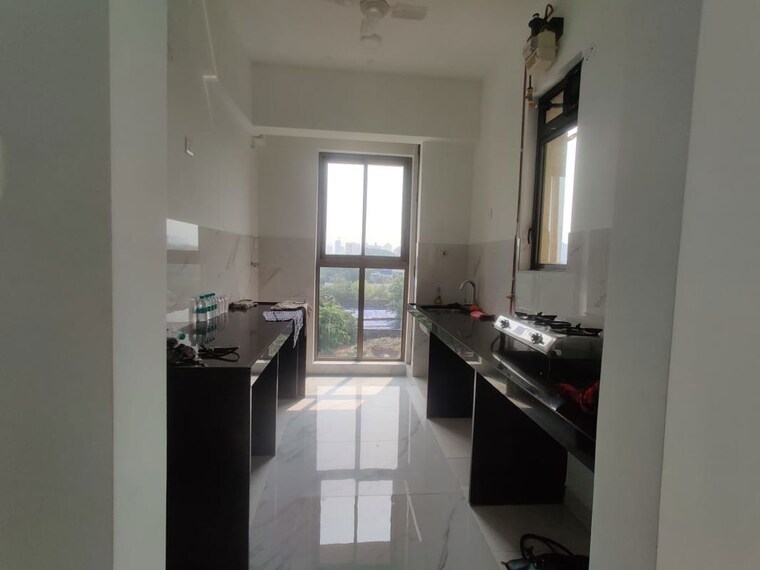 Kitchen, raymond-ten-x-habitat 2 Bedroom 800 Sq.Ft. Apartment In Pokhran Road No Two Thane 10655292