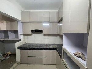Kitchen in 2 BHK Apartment at Shri Radha Aqua Garden, Sector 16b Greater Noida – for Sale