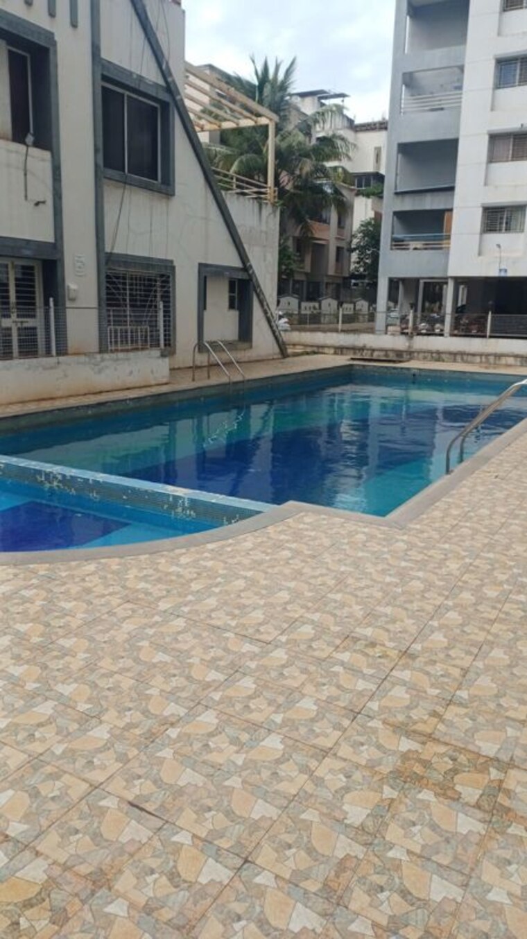 Swimming Pool, solitaire-co-op-housing-society-ltd 2 Bedroom 905 Sq.Ft. Apartment In Dhanori Pune 10655832