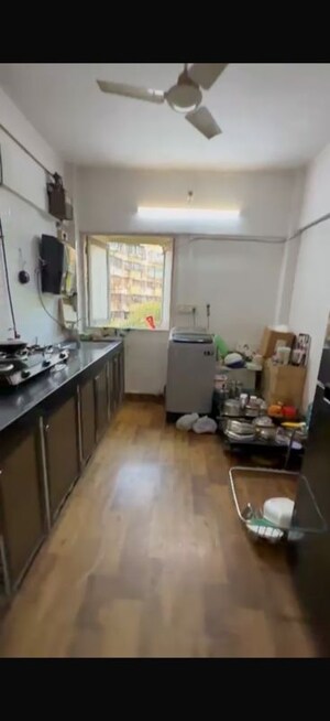 Kitchen in 2 BHK Apartment at Chanchal Kalyan Complex, Yari Road – for Rent
