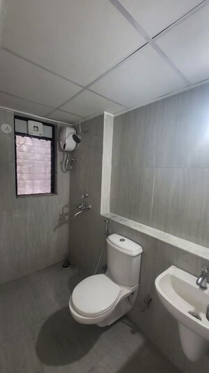 Bathroom in 1 BHK Apartment at Runwal Gardens, Dombivli East – for Rent