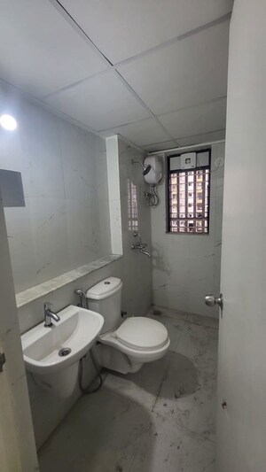 Bathroom in 1 BHK Apartment at Runwal Gardens, Dombivli East – for Rent