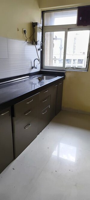 Kitchen in 1 BHK Apartment at Squarefeet Ace Square, Thane West – for Rent