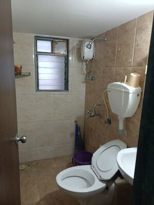 Bathroom in 2 BHK Apartment at Vinay Unique Gardens, Virar West – for Sale