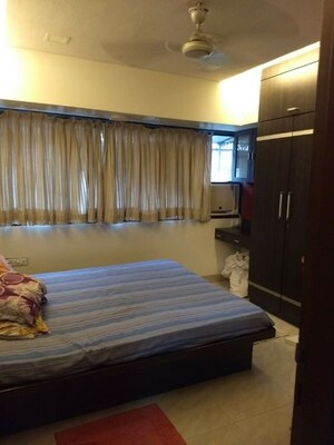 Bedroom in 2 BHK Apartment at Satellite Garden, Goregaon East – for Rent