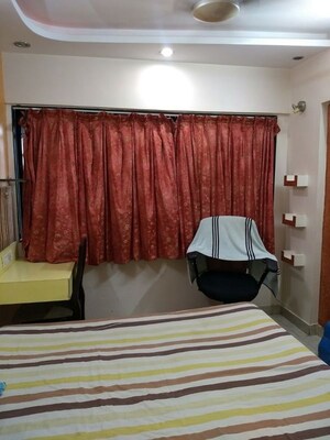 Bedroom in 2 BHK Apartment at Satellite Garden, Goregaon East – for Rent