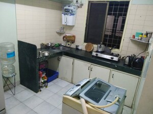 Kitchen in 1 BHK Apartment at Tulip CHS, Kalyani Nagar – for Rent