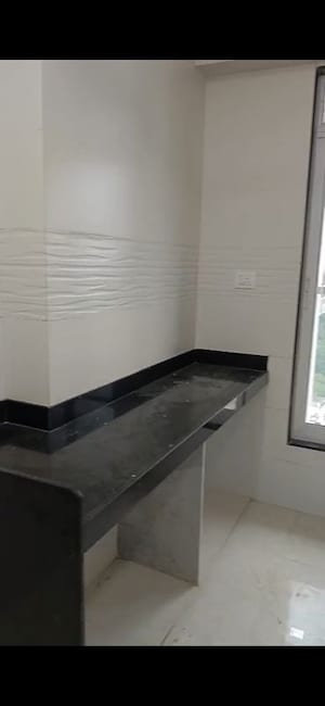 Kitchen in 2 BHK Apartment at Triumph Swastik, Malad West – for Sale