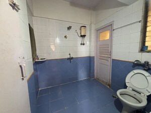 Bathroom in 1 BHK Apartment at Dosti Group Maitri Gardens, Oswal Park – for Rent