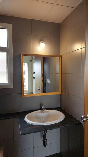Bathroom in 3 BHK Apartment at Pashmina Waterfront, Old Madras Road – for Rent