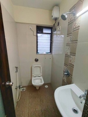 Bathroom in 1 BHK Apartment at Shree Sai D N Nagar Shivneri CHS Ltd, Andheri West – for Rent