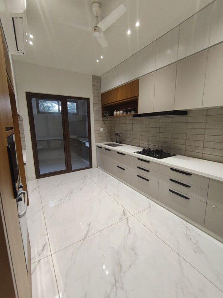 Kitchen, bay-nilamber-nirvaan 4 Bedroom 2318 Sq.Ft. Villa In Old Padra Road Vadodara 10658839