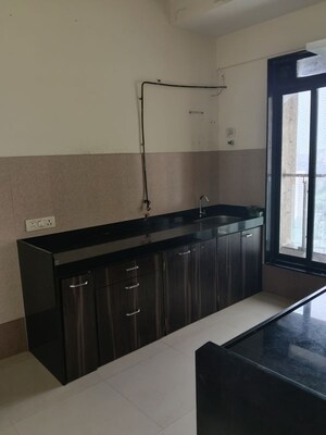 Kitchen in 2 BHK Apartment at Rustomjee Elanza, Malad West – for Rent