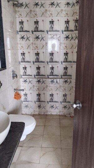 Bathroom in 2 BHK Apartment at Ravinanda Skylights, Wagholi – for Rent