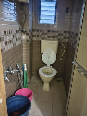 Bathroom in 1 BHK Apartment at Juhu Taj CHS, Vile Parle West – for Rent