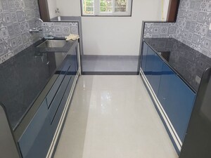 Kitchen in 4 BHK Apartment at Ethique Hrishikesh CHS, Model Colony – for Rent