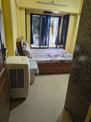 Bedroom in 1 BHK Apartment at Akshar Apartments, Borivali West – for Rent