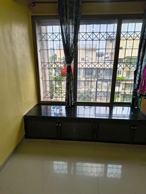 Bedroom in 1 BHK Apartment at Akshar Apartments, Borivali West – for Rent