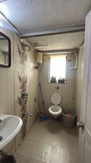 Bathroom in 2 BHK Apartment at Evershine Apartment 2, Andheri West – for Sale