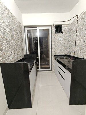 Kitchen in 1 BHK Apartment at Raunak Residency Thane, Pokhran Road No One – for Rent