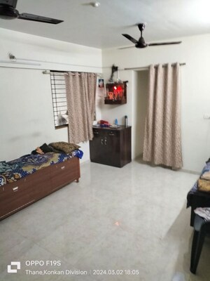 Living Room in 1 BHK Apartment at Lodha Palava Downtown, Dombivli East – for Rent